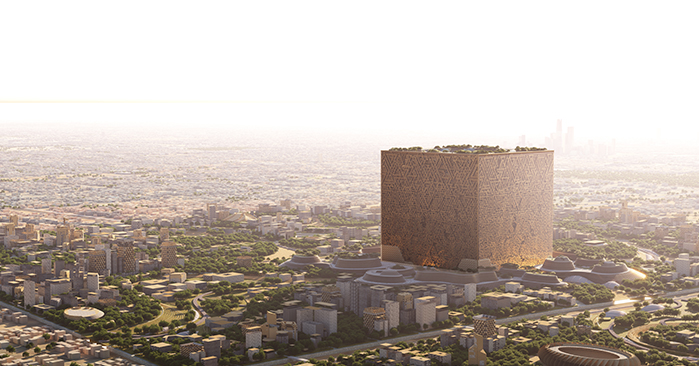 An expansive city skyline with a unique, large cube-shaped building dominating the view, featuring intricate patterns on its facade and a green rooftop garden, all bathed in the warm glow of a setting or rising sun."