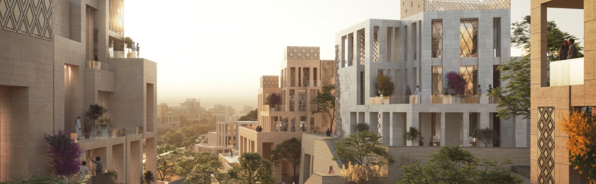 Modern hillside residential buildings with terraces and lush greenery at sunset.