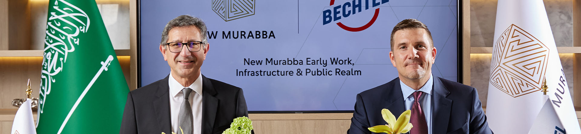 Sabah Barakat, Acting CEO, New Murabba Dev. Co. & Jacob Mumm, Senior VP, Bechtel, pose for formal photo at New Murabba's Signing Ceremony