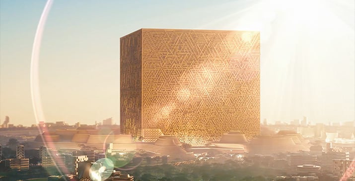 A futuristic golden Mukaab with intricate patterns gleaming in the sunlight against an urban skyline.